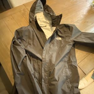 Like new black men’s medium North Face hooded rain jacket.